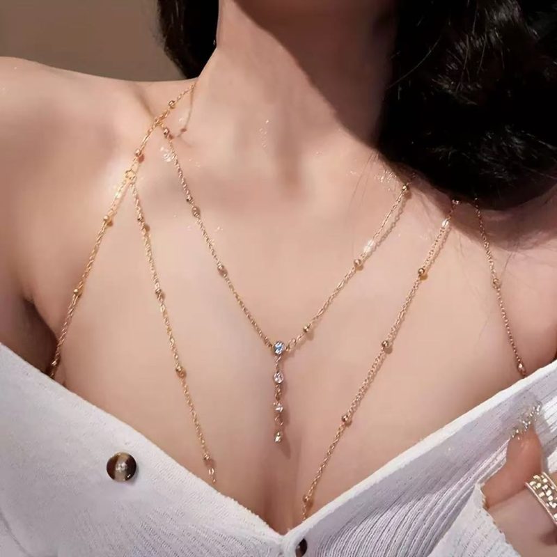 Meet the brilliance and enjoy the refinement! This multi-layer gold chain necklace is woven with delicate chains to create a unique layer, dotted with round beads and sparkling water diamonds, which are lively and charming.